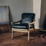 Armchair in scandinavian design Podium on legs